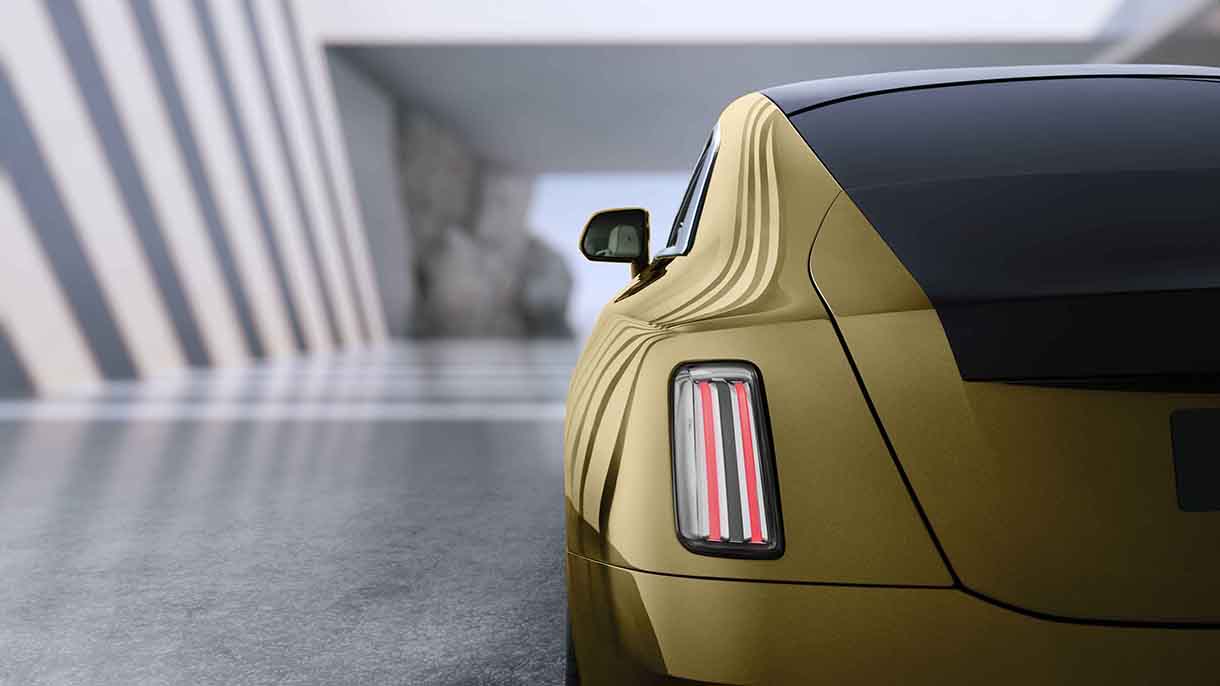 Rear detail shot of gold 2023 Rolls-Royce Spectre 